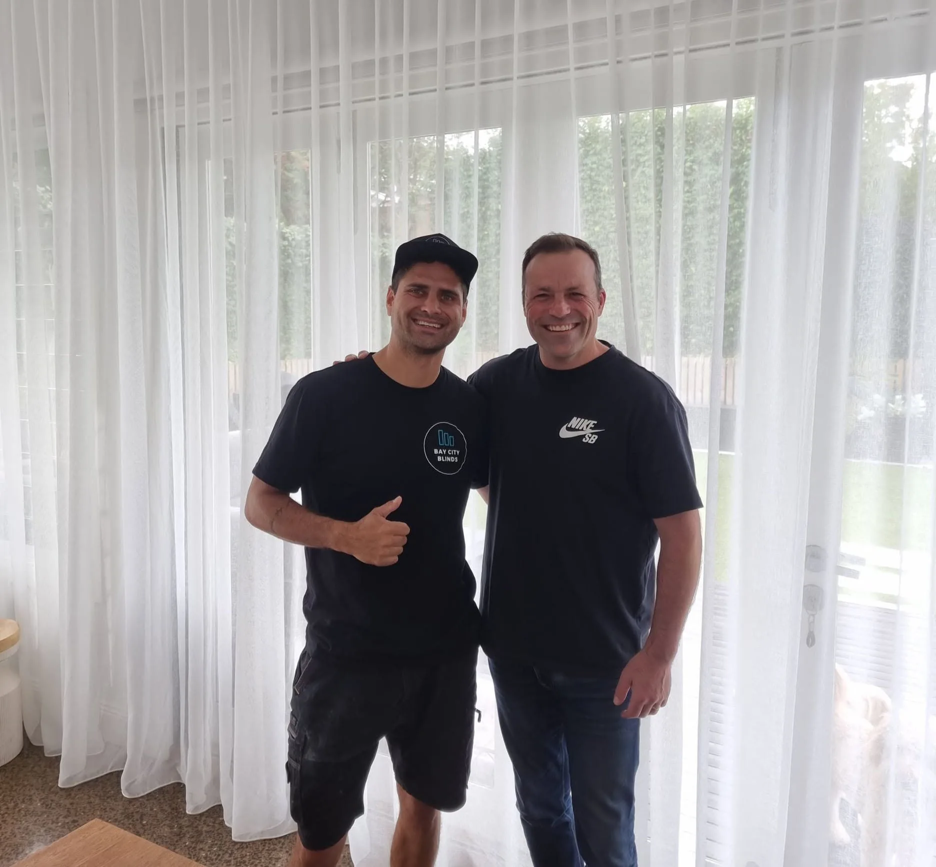 Jackson and Brad Johnson from Bay City Blinds after a sheer curtains install, Geelong