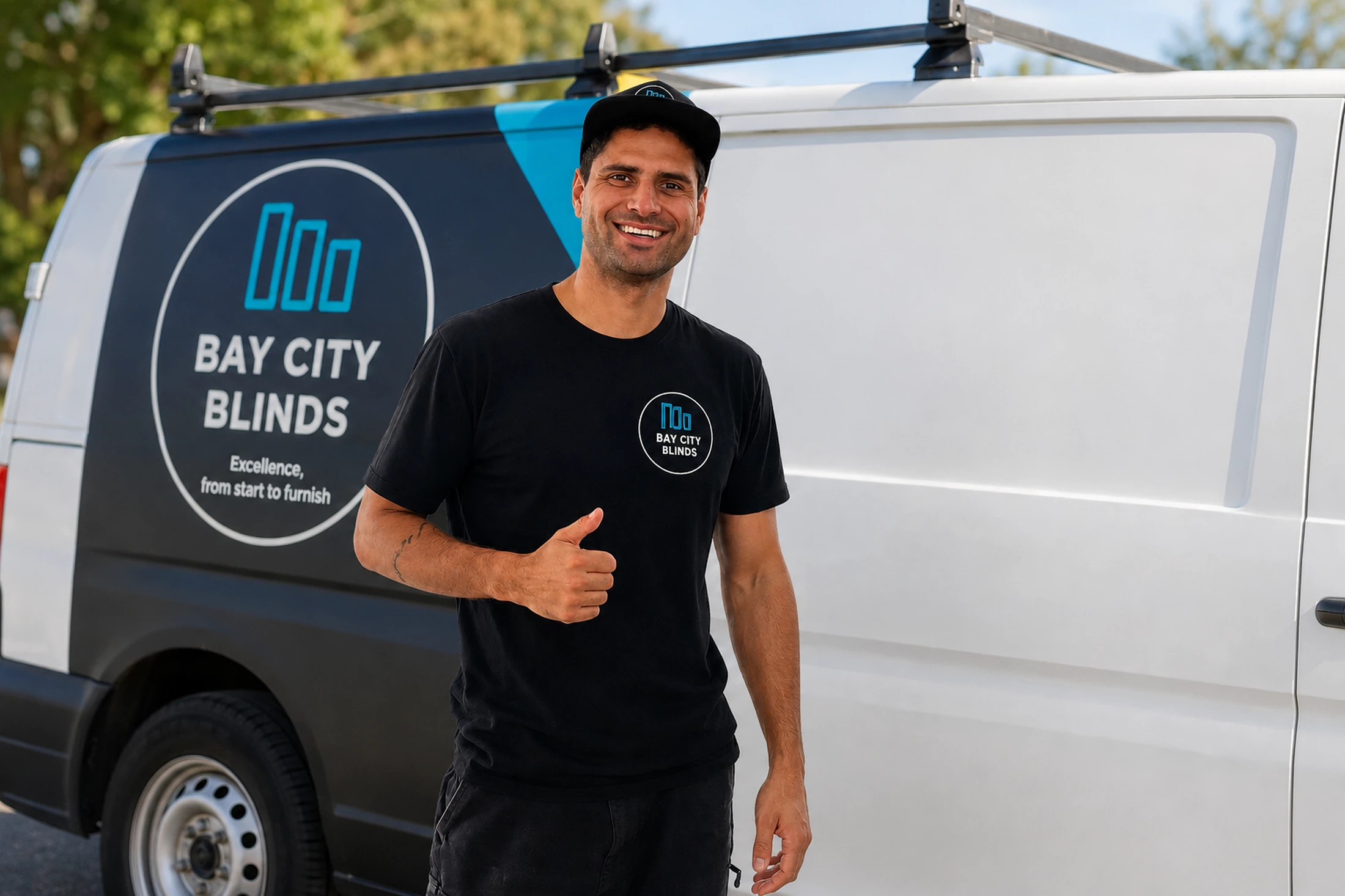 Jackson from Bay City Blinds giving a thumbs up in front of his branded mobile showroom van in Geelong